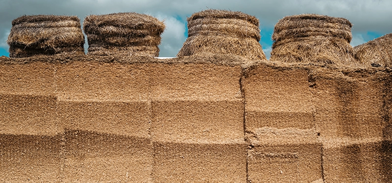 Farmer checking silage stocks in a farmyard before winter